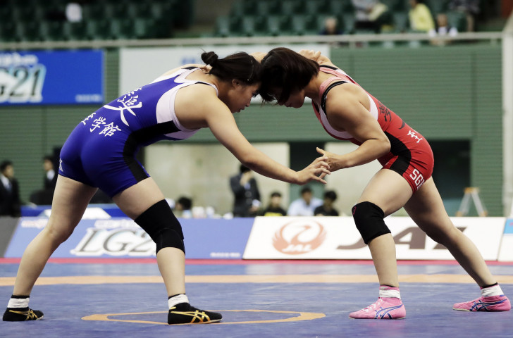 Japan's world junior champion Saki Igarashi, left, added the UWW under-23 world title at 55kg to her CV in Bucharest tonight, as her sister Miho successfully defended the 50kg title ©Getty Images  