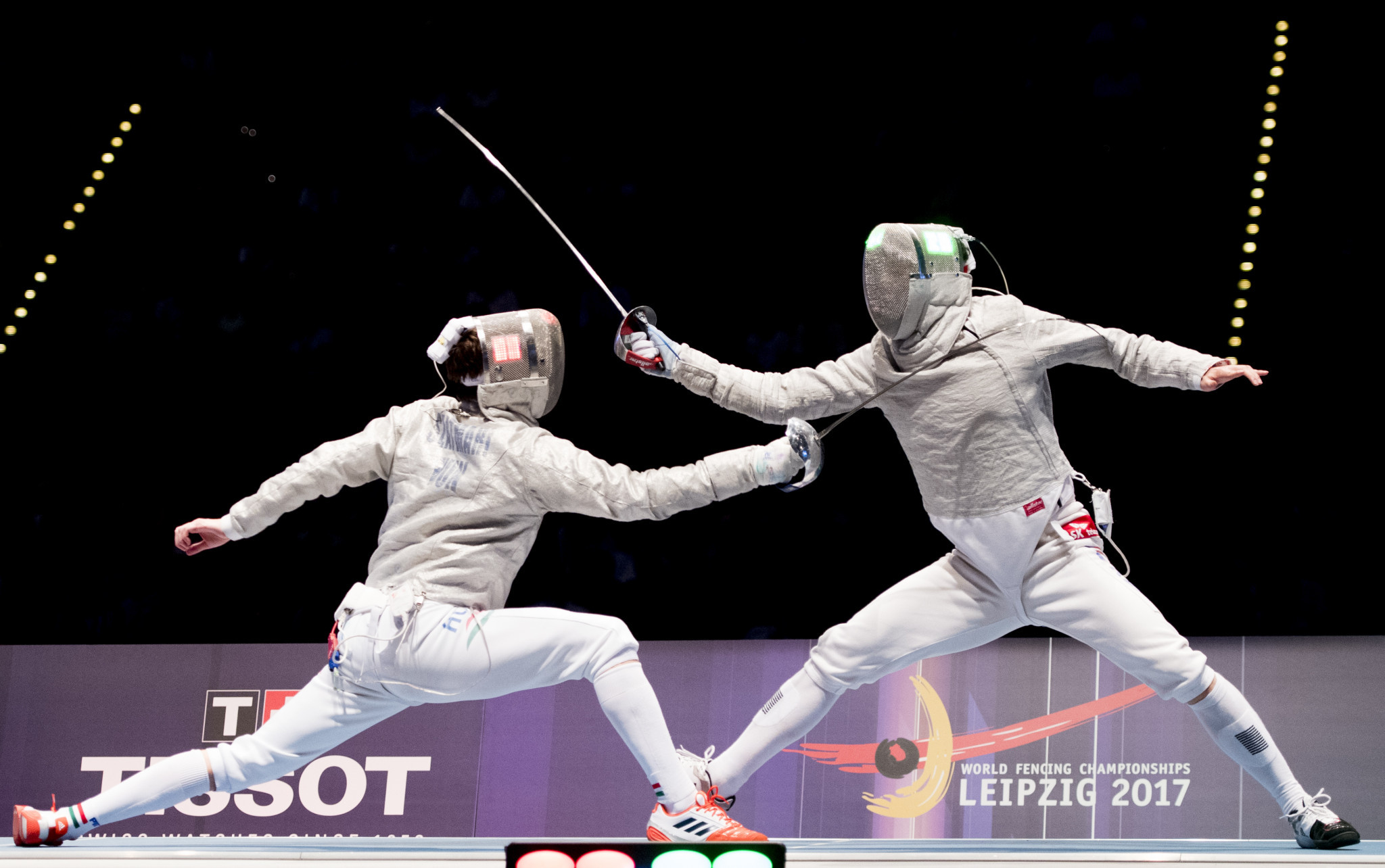 Gu Bong-il, pictured right, made up for individual disappointment with gold for South Korea in the team event at the FIE Men's Sabre World Cup in Algiers ©Getty Images  