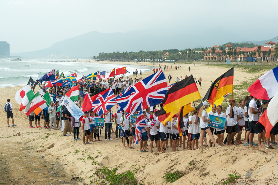 Athletes from each of the competing nations paraded down the beach during the Opening Ceremony ©ISA/Sean Evans