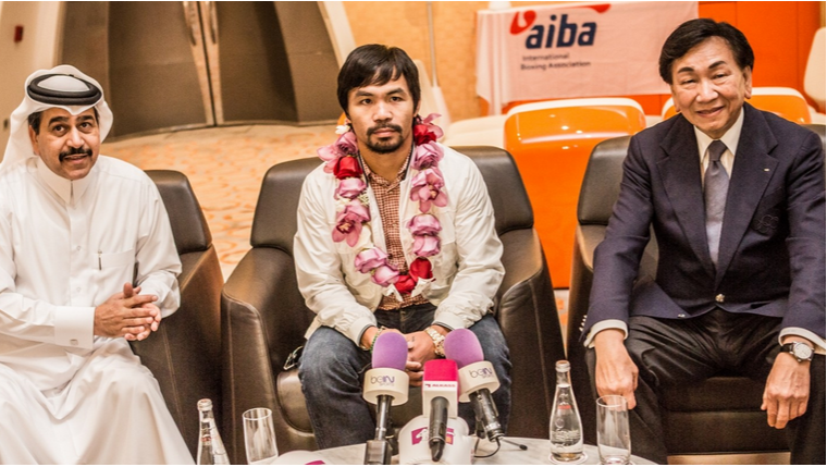 Manny Pacquiao (centre) was welcomed here by Yousuf Ali Al-Kazim (left), President of the Qatar Olympic Committee and executive director of the Local Organising Committee, and C K Wu, President of AIBA (right)