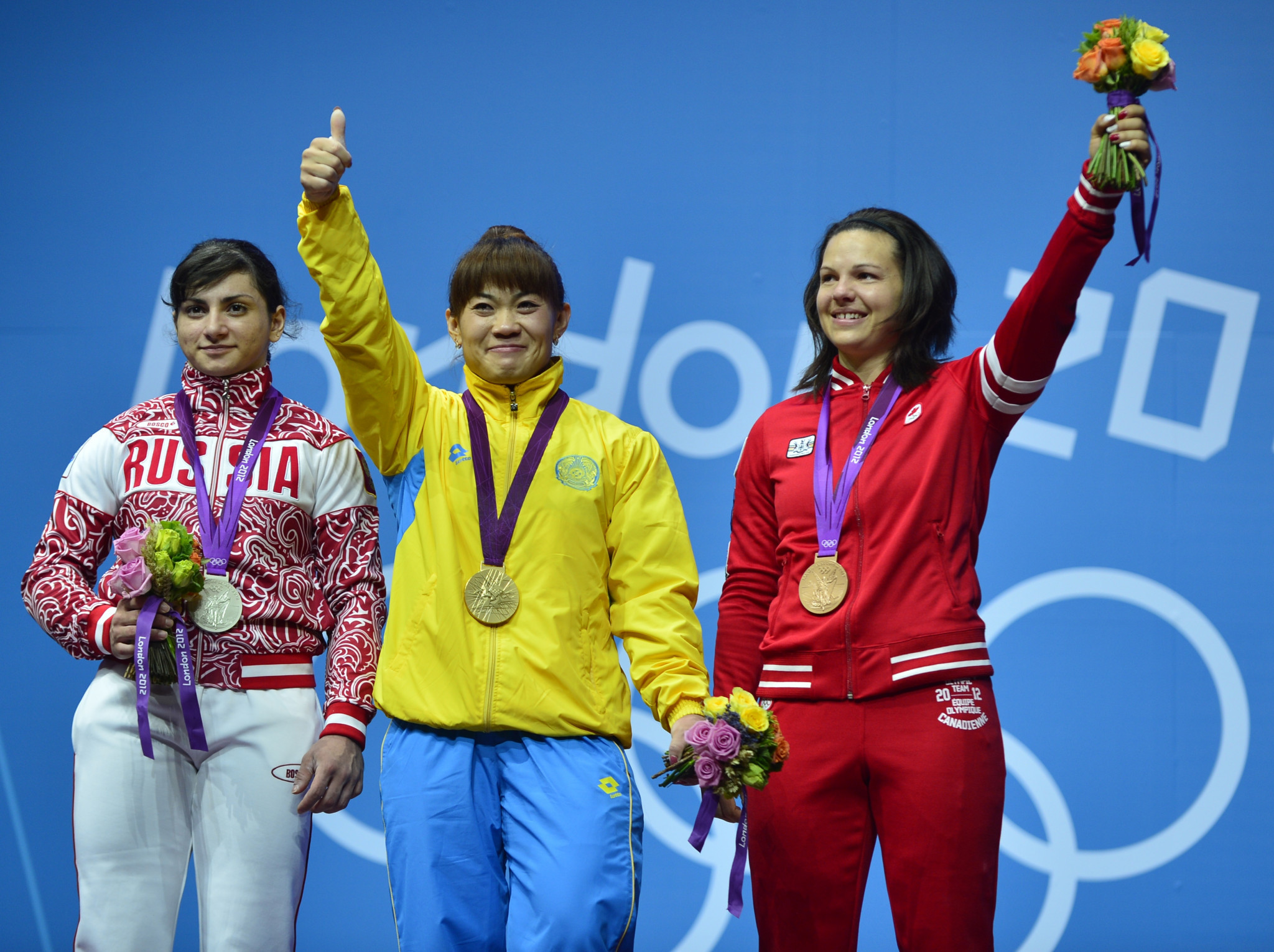Christine Girard, right, originally finished behind Kazakhstan’s Maiya Maneza, centre, and Russia’s Svetlana Tsarukayeva, left, at London 2012, but they were both disqualified for doping ©Getty Images