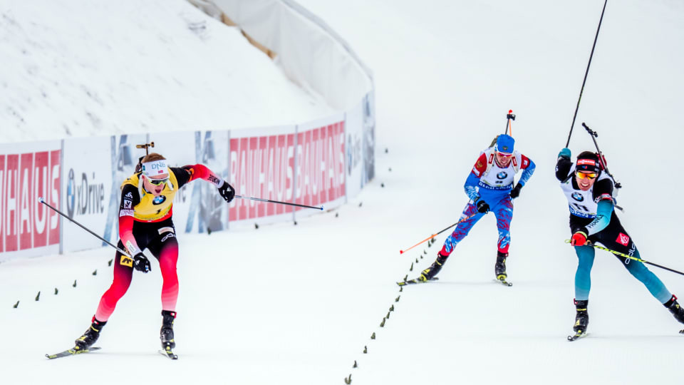Johannes Thingnes Bø of Norway, left, earns a narrow win at the IBU World Cup 12.5km pursuit event in Slovenia ©IBU