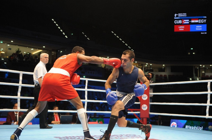 Cuban middlweight Arlen Lopez (red) saw off the challenge of Egypt's Hosam Abdin (blue)