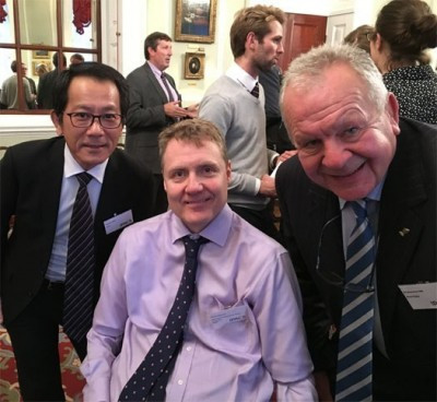 IWRF President Richard Allcroft, centre, in London with Takahiro Waku of the Japan Sports Council, left, and Bill Beaumont, chairman of World Rugby ©IWRF
