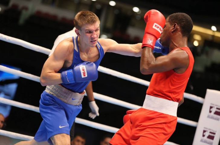 Russia's Vitaly Dunaytsev (blue) upset the odds to overcome number one seeded light weltwerweight Yasniel Toledo Lopez (red) of Cuba ©AIBA/Facebook