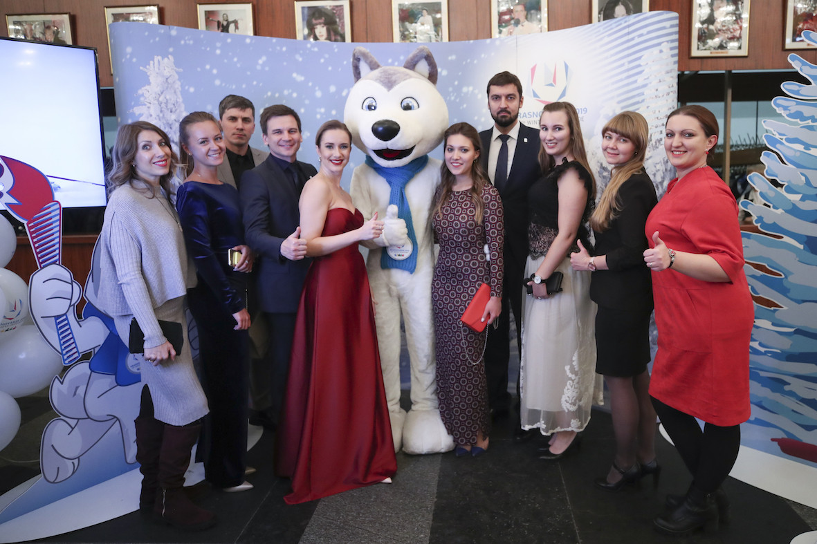 Guests at the Russian Students Sport Union gala in Moscow are drawn to the personal magnetism of the 2019 Krasnoyarsk Winter Olympiade mascot U-Laika ©RSSU 