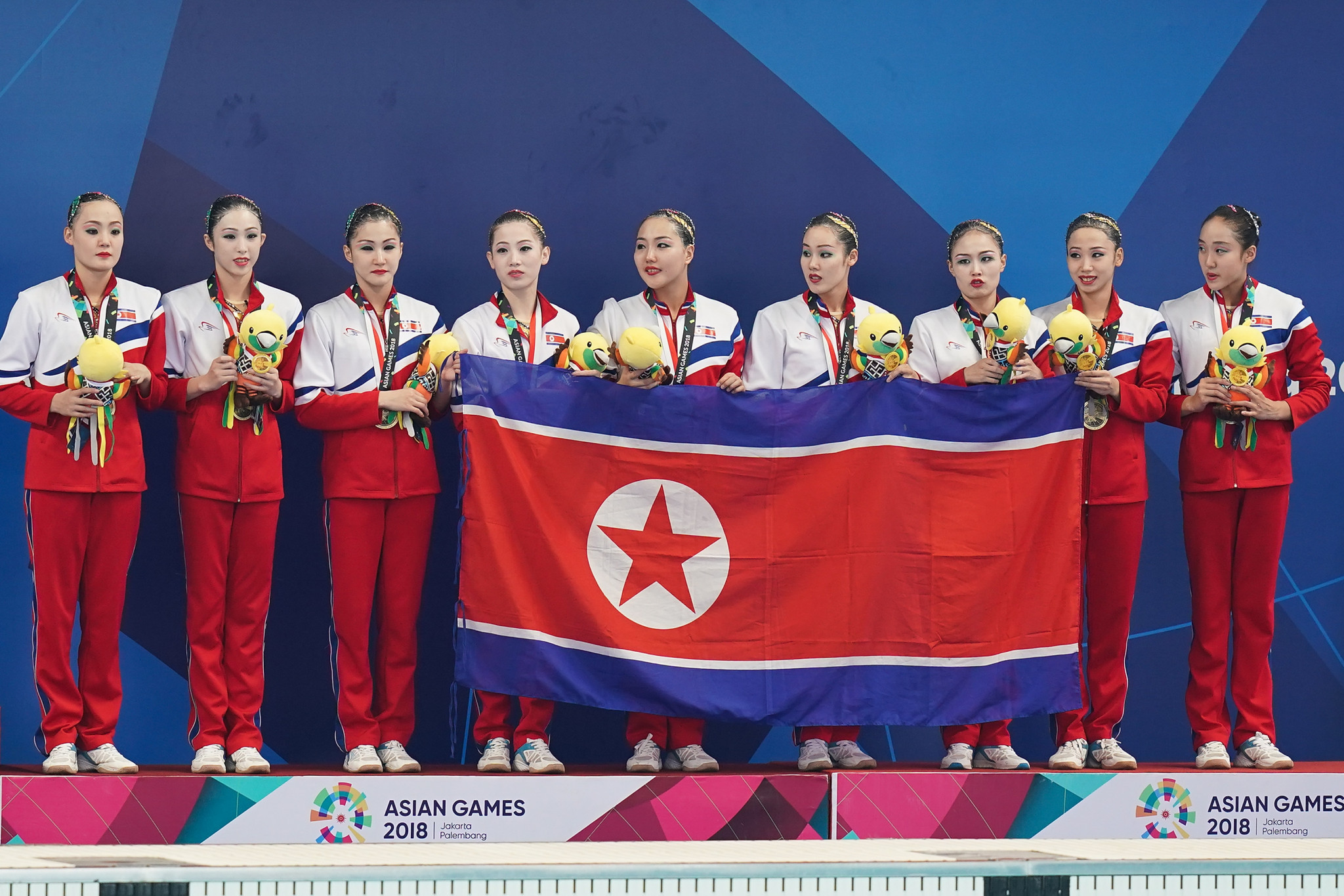 Bronze medallist North Korea celebrate during the victory ceremony for the artistic swimming women's teams free routine final at GBK Aquatic Center in Jakarta ©Getty Images