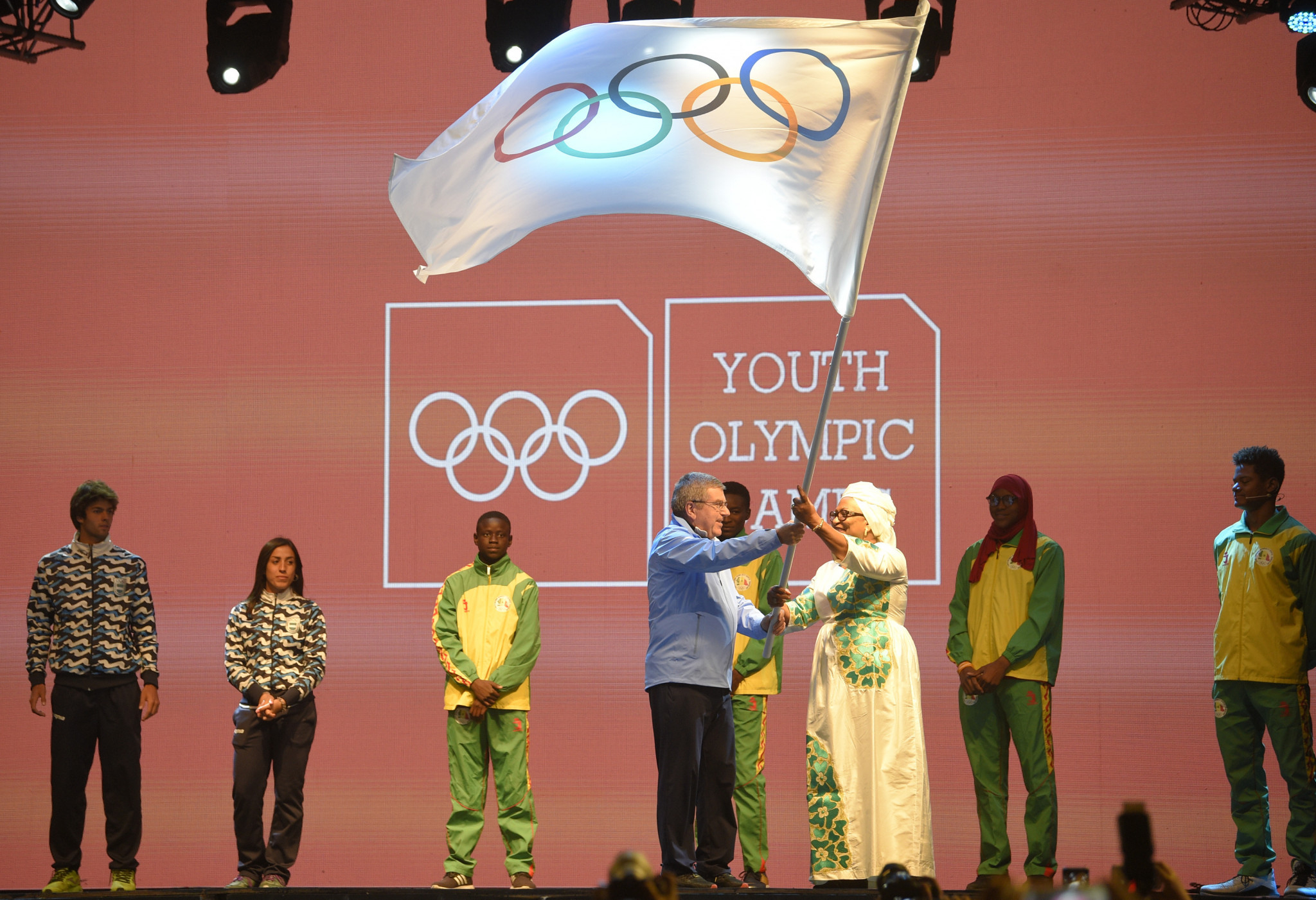 During the closing ceremony, International Olympic Committee President Thomas Bach transfers the flag to a representative of Senegal, who will host the next Youth Olympic Games in 2022 ©Getty Images