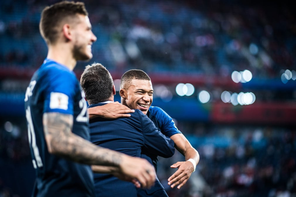 Young player of the tournament Kylian Mbappé is embraced after France beat Belgium in the semi final ©Getty Images