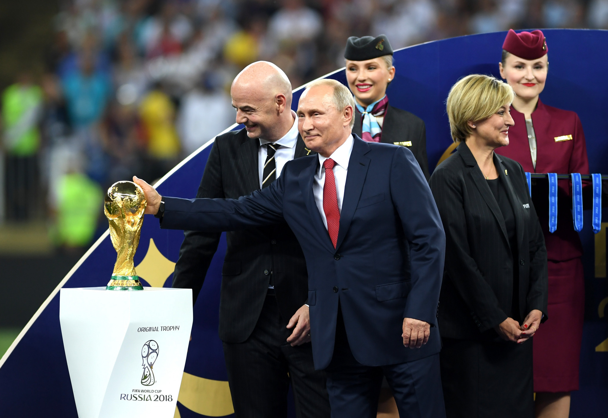 Russian President Vladimir Putin caresses the trophy next to FIFA president Gianni Infantino during the trophy ceremony at the end of the Russia 2018 World Cup final  ©Getty Images