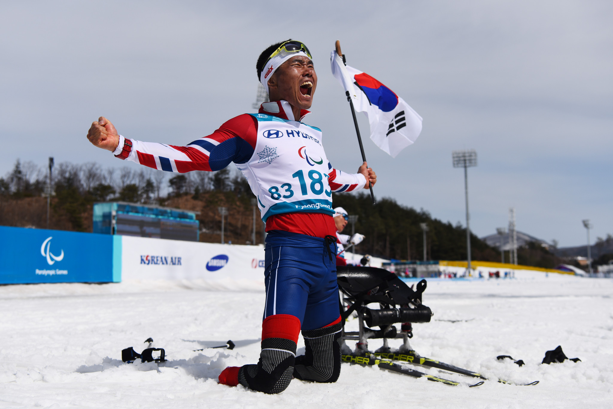 Eui Hyun Sin celebrates winning hosts South Korea's sole gold of the Games in cross-country skiing ©Getty Images