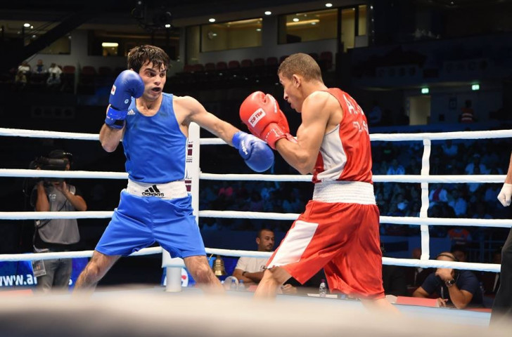 Azerbaijan's Elvin Mamishzada (blue) produced the only TKO victory of the semi-finals to reach the flyweight gold medal match ©AIBA/Facebook