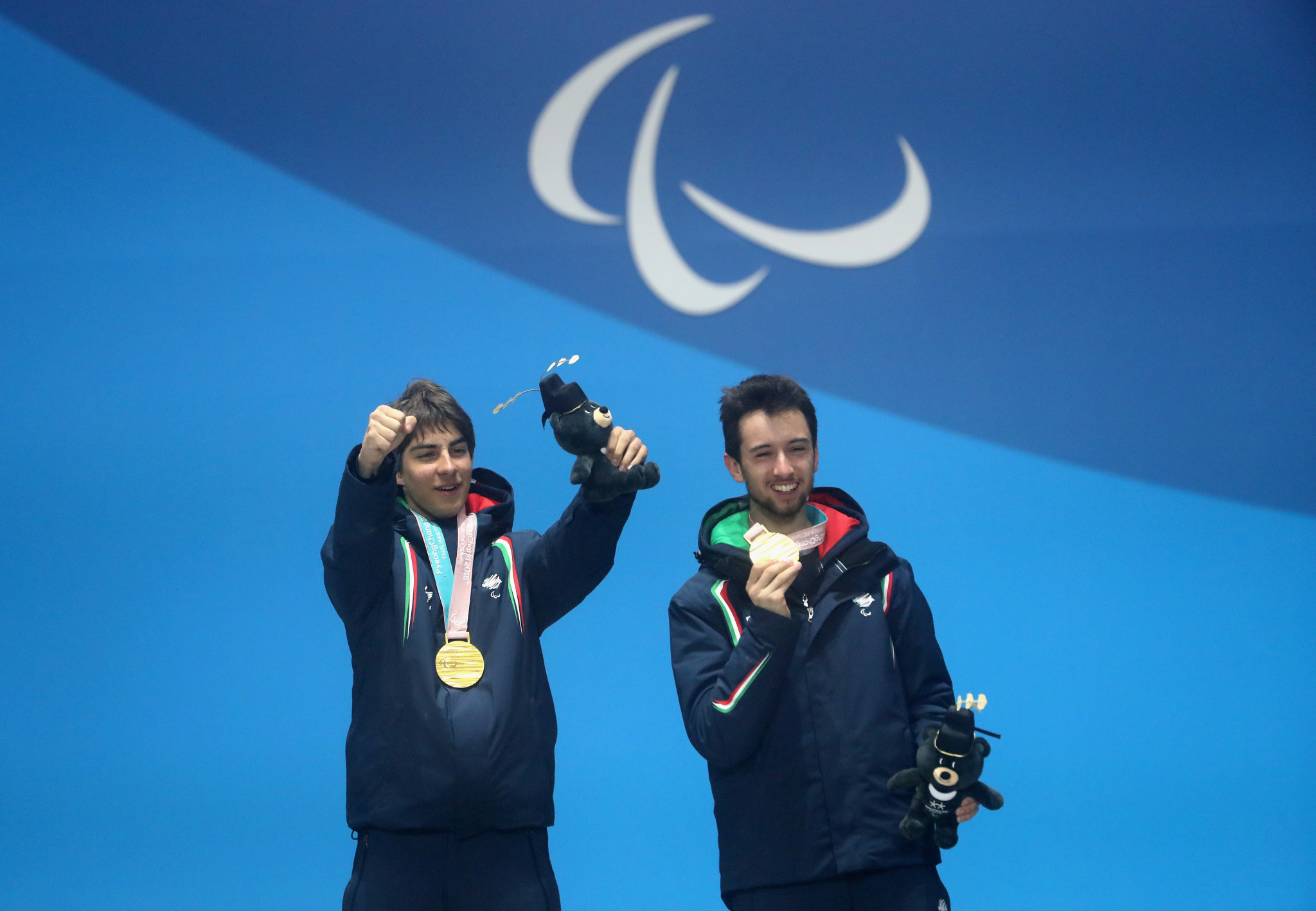 Giacomo Bertagnolli and his guide Fabrizio Casal celebrate winning gold at the Pyeongchang 2018 Winter Paralympics ©Getty Images