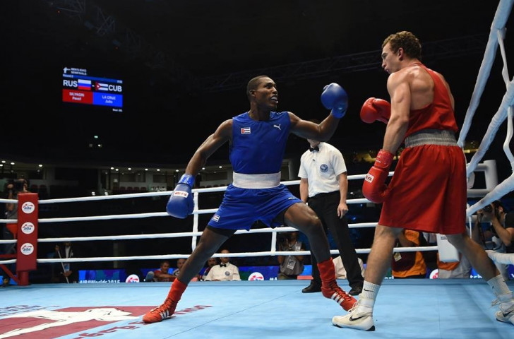 Light heavyweight Julio La Cruz (blue) completed a hat-trick of wins for Cuba on the night, overcoming Russia's Pavel Silyagin (red) ©AIBA/Facebook