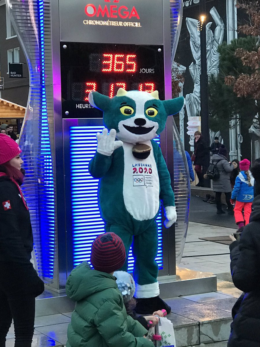 Lausanne 2020 mascot Yodli posed for photos in front of the countdown clock on the medal plaza ©Lausanne 2020