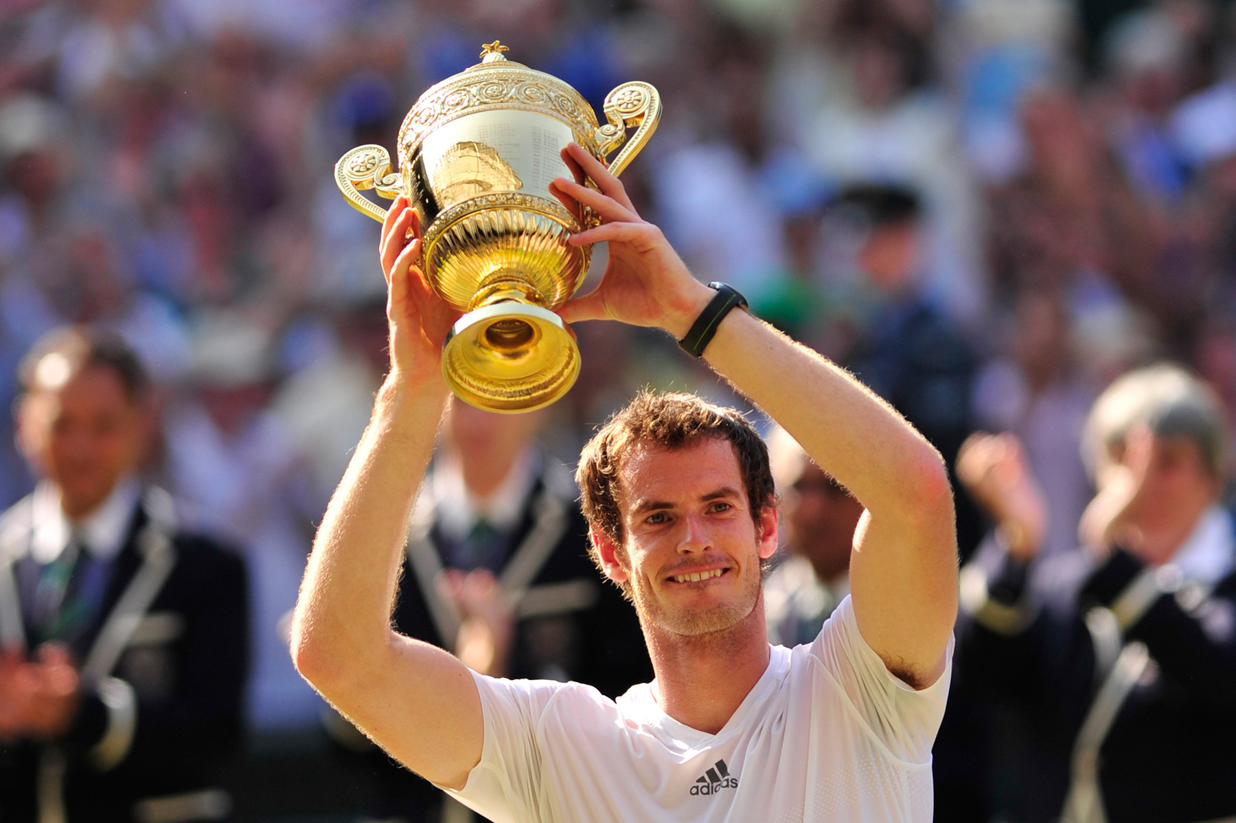Andy Murray ended Britain's 77-year wait for a winner of the men's singles title at Wimbledon when he lifted the trophy in 2013 - a year after winning the Olympic gold medal on the same court ©Getty Image