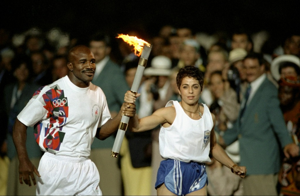 Evander Holyfield won bronze at Los Angeles 1984 and carried the Olympic Torch during the Opening Ceremony of Atlanta 1996