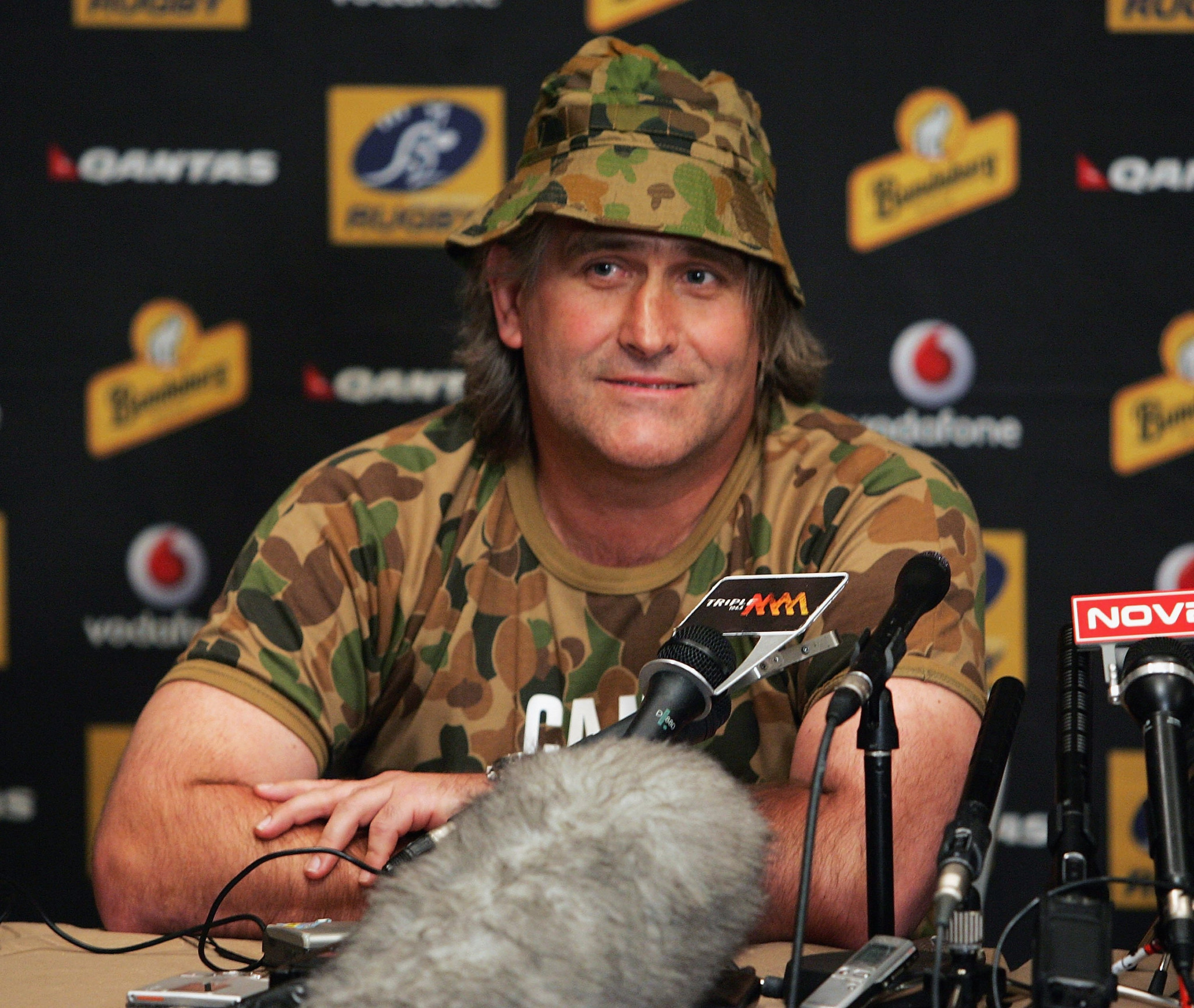 Former Australian attack coach Scott Johnson poked fun at suggestions of spying by wearing camouflage to a press conference ©Getty Images