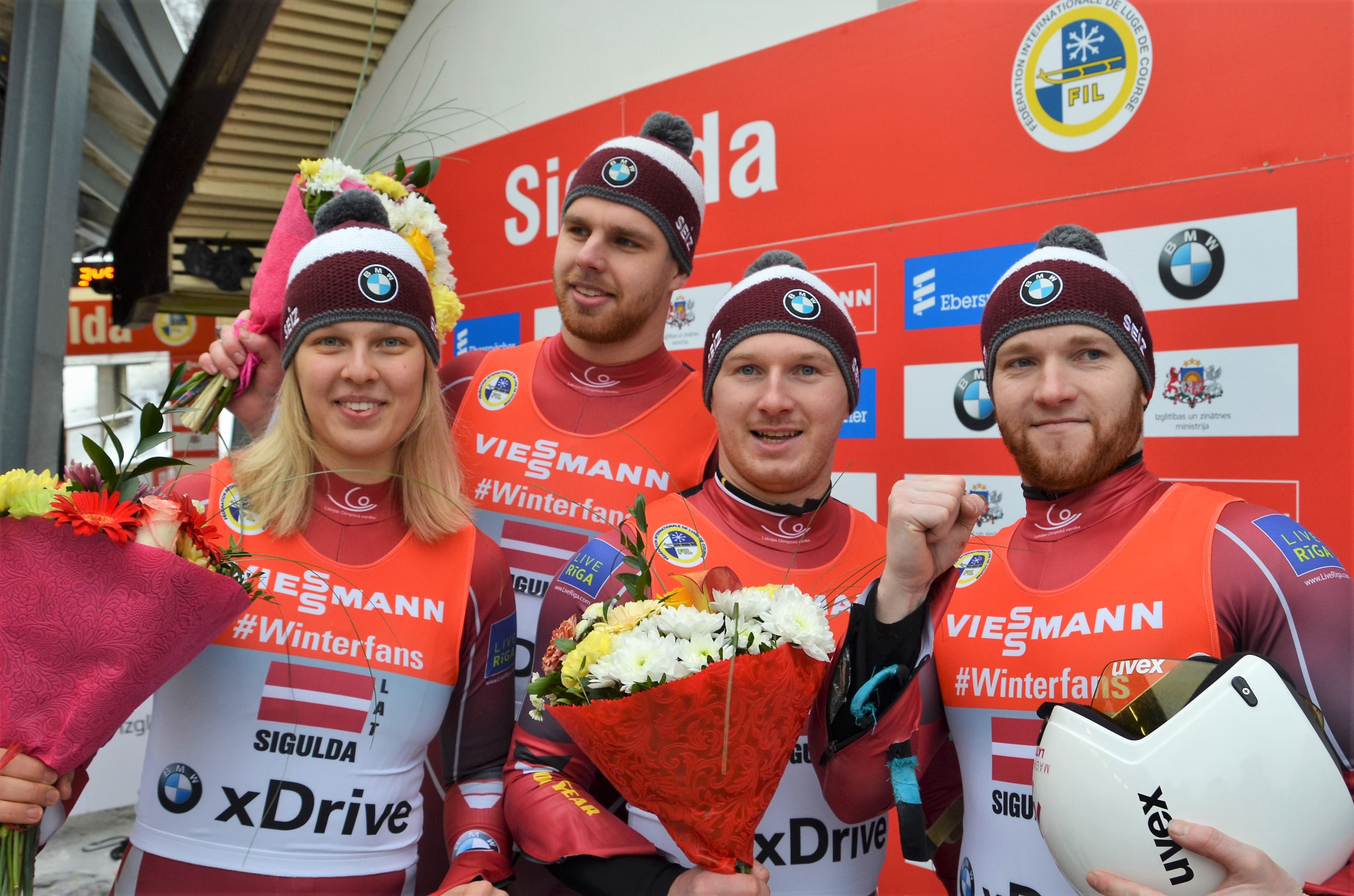 Latvia's relay team of Kendija Aparjode, Kristers Aparjods, Oskars Gudramovics and Peteris Kalnins delighted the crowd in Sigulda by winning the World Cup event today ©FIL
