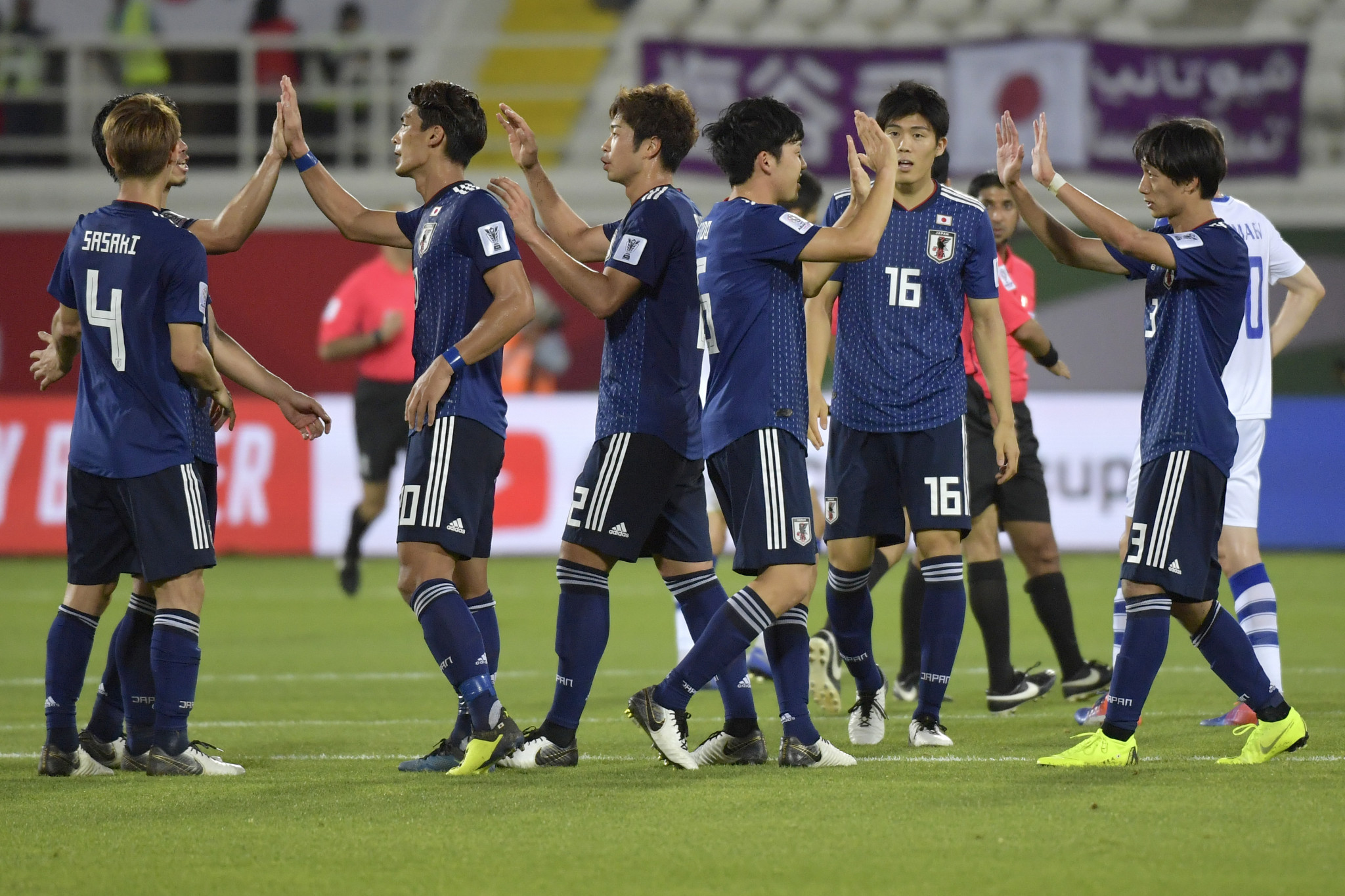 Four-time champions Japan beat Uzbekistan 2-1 to win Group F ©Getty Images