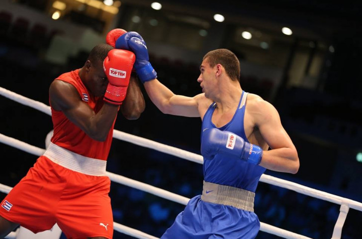 Russia's Evgeny Tishchenko (blue) beat Cuba's Erislandy Savon (red) to the heavyweight gold medal