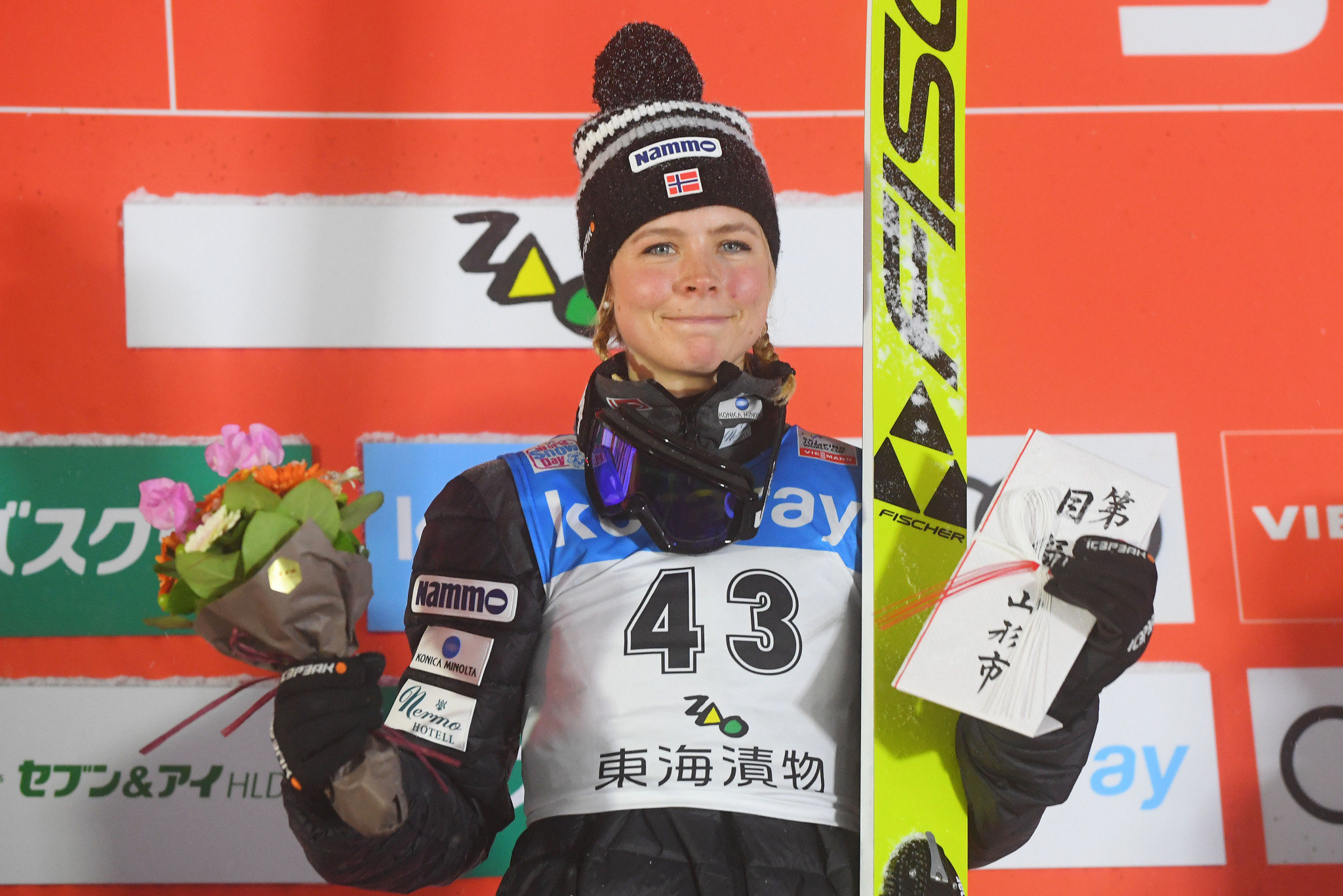 champion at Ski Jumping World Cup event in Zao