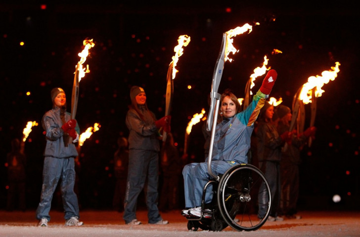 Former wheelchair basketball player Marni Abbott-Peter, pictured here carrying the Paralympic Torch during the Opening Ceremony of the Vancouver 2010 Winter Games, has also been inducted into the Canadian Paralympic Hall of Fame
