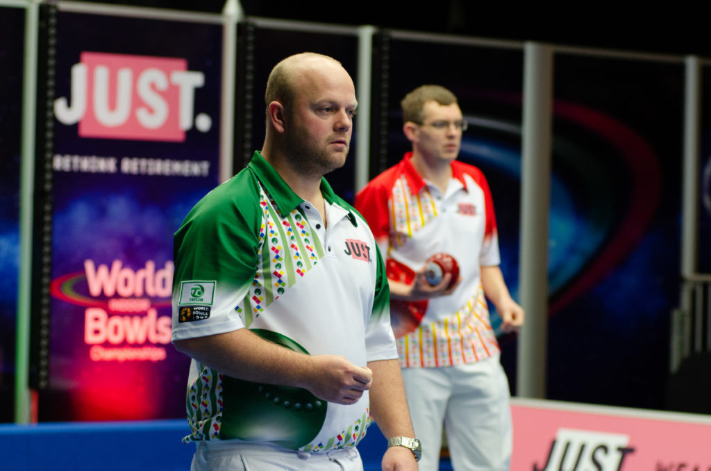 Defending champion Mark Dawes, back, missed out on a place in the men’s singles semi-finals at the World Indoor Bowls Championships after losing to Scotland’s Stewart Anderson in Norfolk today ©World Bowls Tour