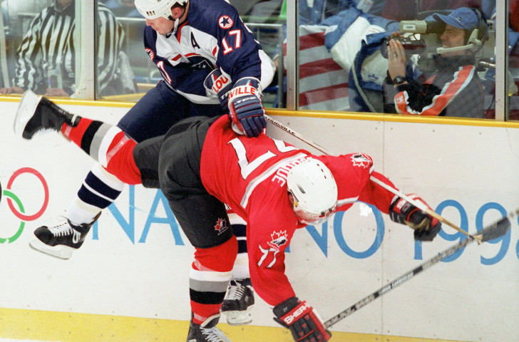 
Canada’s Raymond Bourque and United States forward Keith Tkachuk collide during their group match at the Nagano Olympics. Four years later Canada would beat the US 5-2 to earn a seventh Olympic title ©Getty Images  
