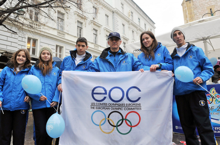 Members of the Bosnian team pose with the European Olympic Committees flag in Sarajevo ©Getty Images  