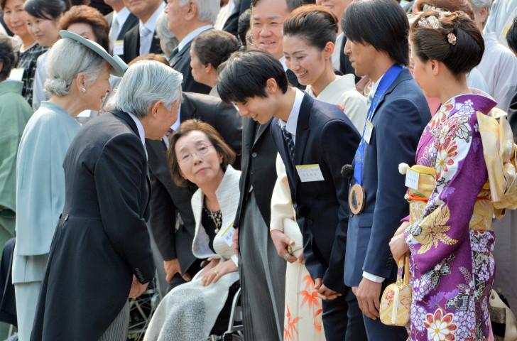 Japan's 19-year-old Yuzuru Hanyu, winner of the 2014 Winter Olympic men's figure skating title on Valentine's Day, feels the love as he is introduced to the Emperor and Empress of Japan during the annual spring garden party at the Akasaka Palace imperial garden in Tokyo ©Getty Images  