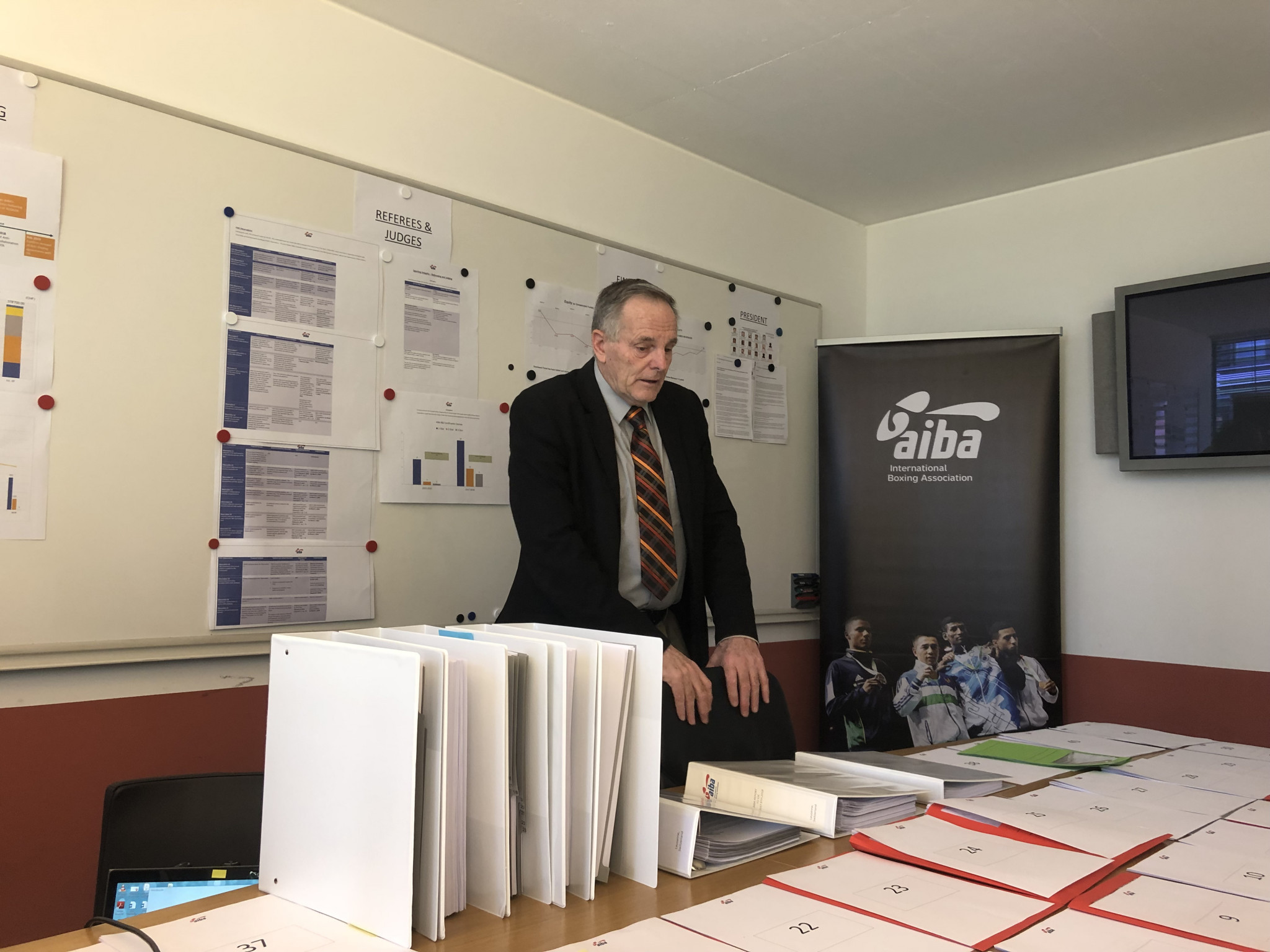 AIBA executive director Tom Virgets looks at some of the 4,000 pieces of documentation provided for the IOC ©ITG