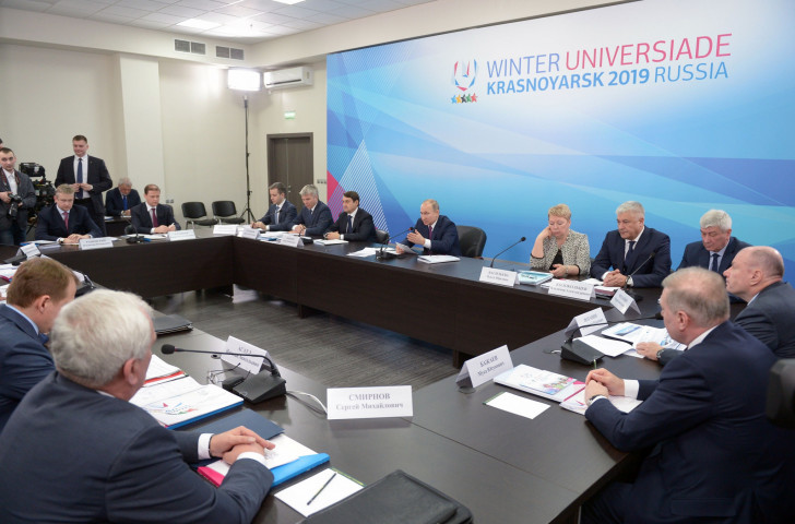 Russian President Vladimir Putin, pictured centre last February chairing a meeting on preparations for Krasnoyarsk 2019, has kept a keen eye on all developments since ©Getty Images  