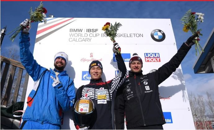 South Korea's Sungbin Yun, centre, won the men's skeleton race at the IBSF World Cup in Calgary but Russia's Alexander Tretiakov, left, took the overall title ©IBSF