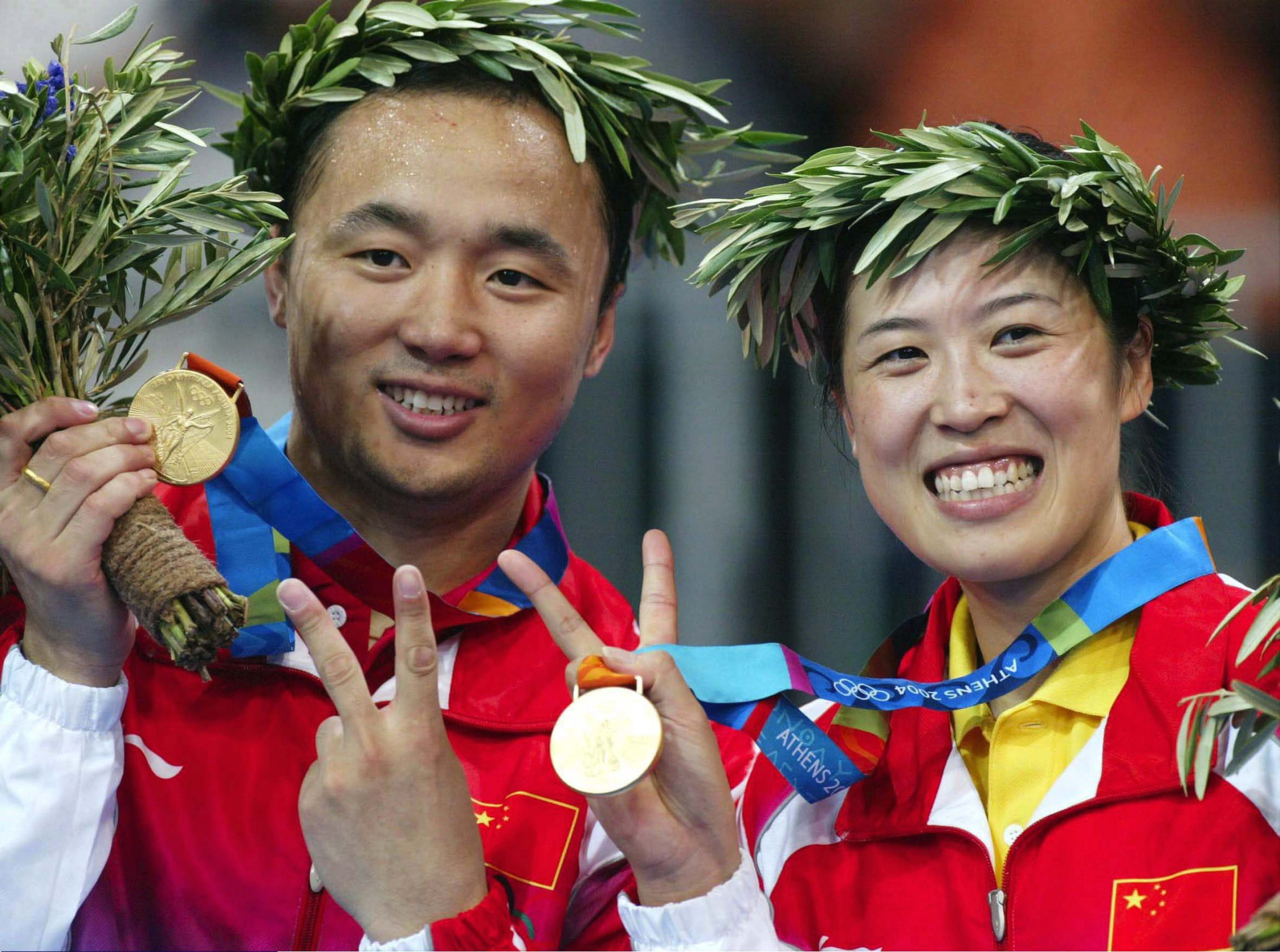Zhang Jun, left, won two Olympic gold medals with his partner Cai Yun, right, at Sydney 2000 and Athens 2004 ©Getty Images