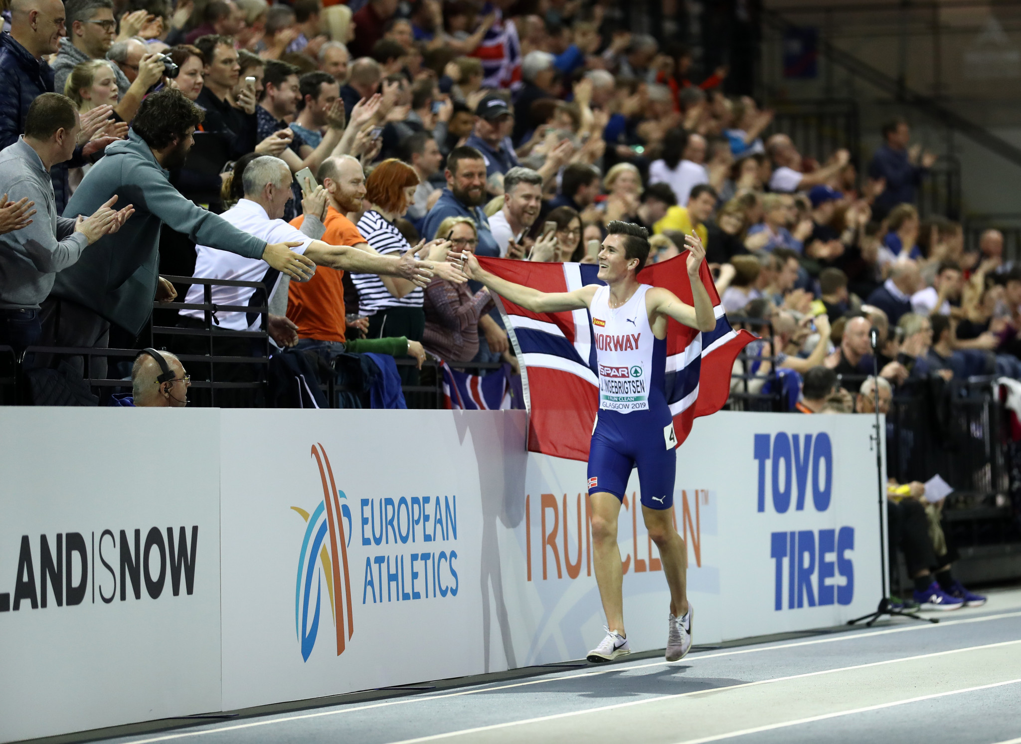 Norway's Jakob Ingebrigtsen enjoys a lap of honour after winning the 3,000 metres at the European Indoor Championships in Glasgow - the first part of what he hopes will be another golden double ©Getty Images 