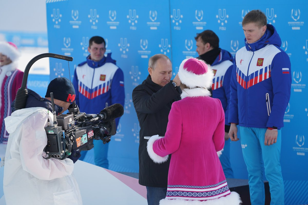 Russian President Vladimir Putin presented medals after a home clean sweep in the men's cross country skiing ©Krasnoyarsk 2019