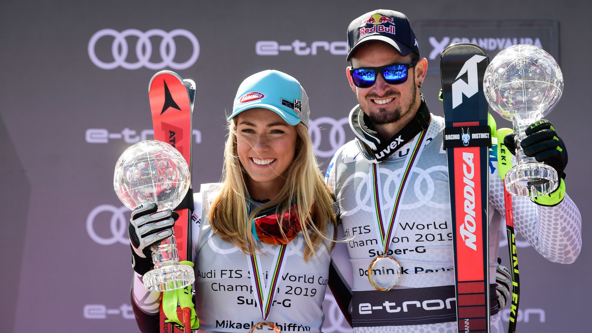 Overall super-G champions at the FIS Alpine Skiing World Cup Finals, Mikaela Shiffrin and Dominik Paris, display their winners' crystal globes in Soldeu ©Getty Images