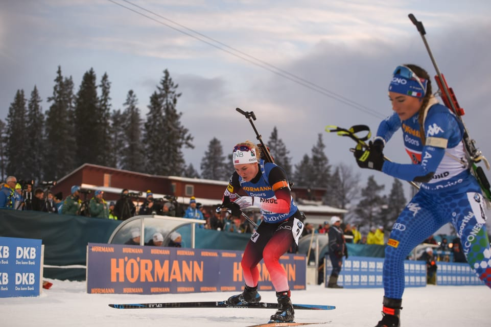 Norway's Marte Olsbu Røiseland, left, en-route to earning gold with Johannes Thingnes Bø in Sweden in the first single mixed relay to be staged at the IBU World Championsihips ©IBU