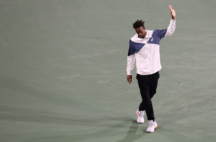 Gael Monfils of France apologises to the crowd after having to withdraw from his quarter-final against Dominic Thiem at the Indian Wells Masters because of an Achlles tendon injury ©Getty Images