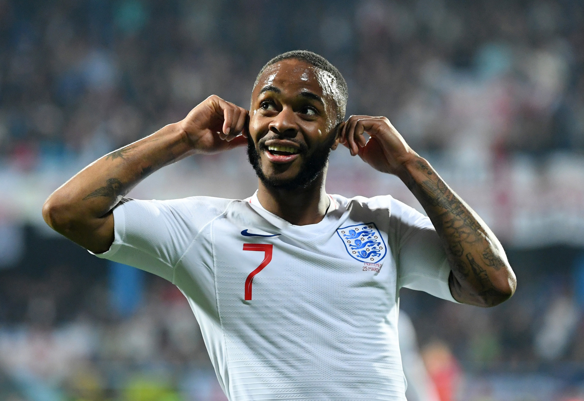 England's Raheem Sterling put his hands to his ears in response to the reported racist abuse he received during the Euro 2020 qualifying match in Montenegro ©Getty Images