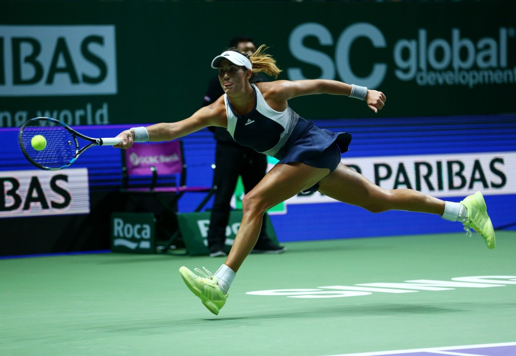 Garbine Muguruza reaches for the ball during her opening victory in Singapore  ©Getty Images