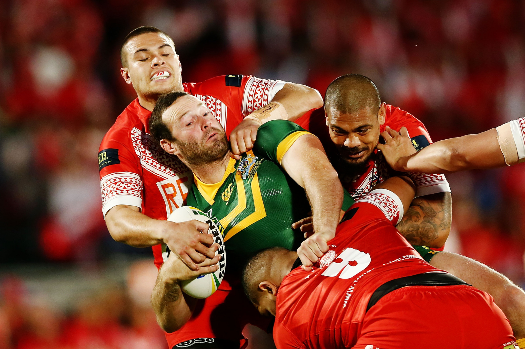 Boyd Cordner of Australia is tackled by Tuimoala Lolohea and Sika Manu of Tonga during the Test between Tonga and Australia in October last year ©Getty Images