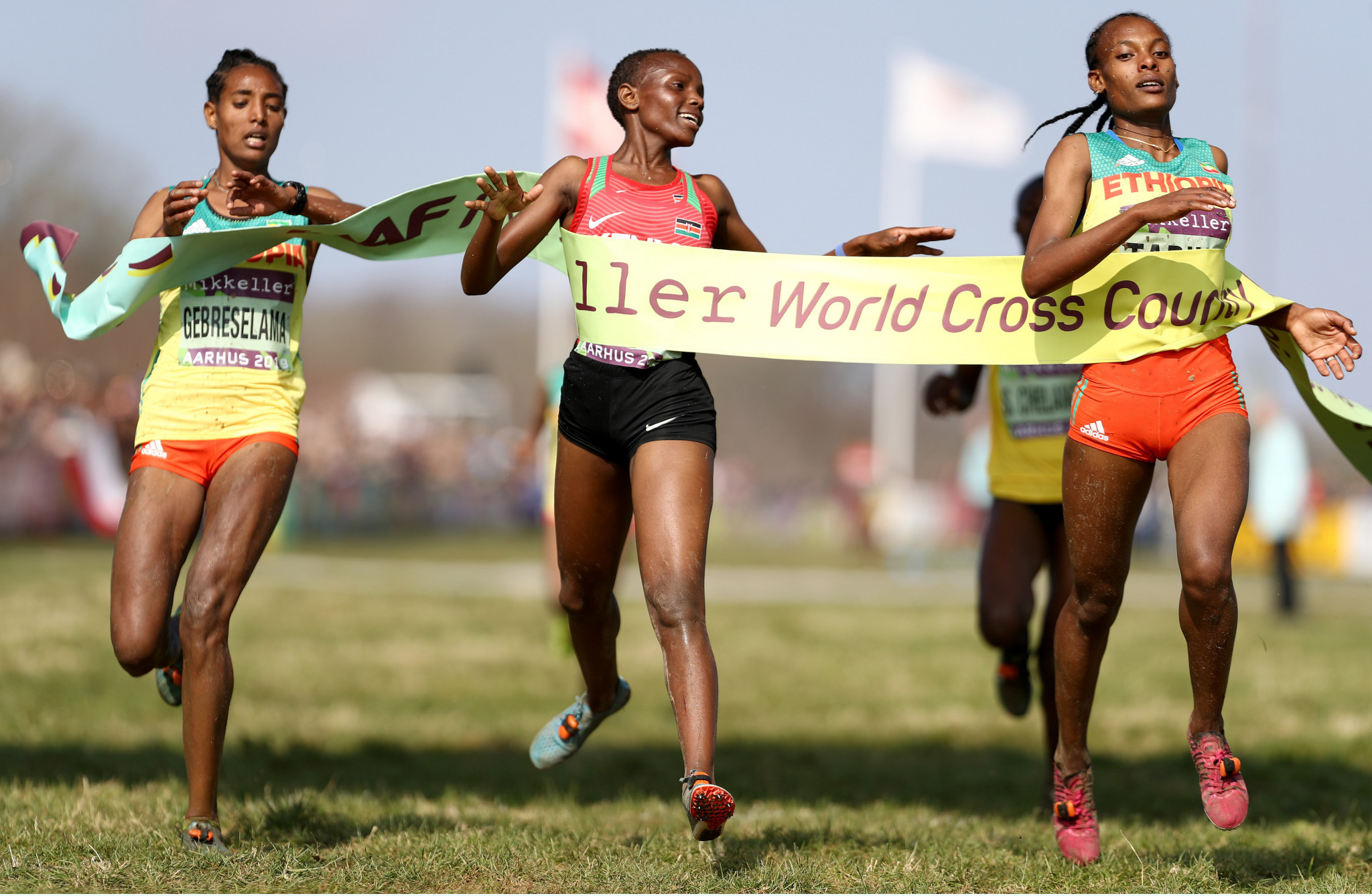 Beatrice Chebet, centre, was awarded the women's under-20 gold after a post race review ©Getty Images