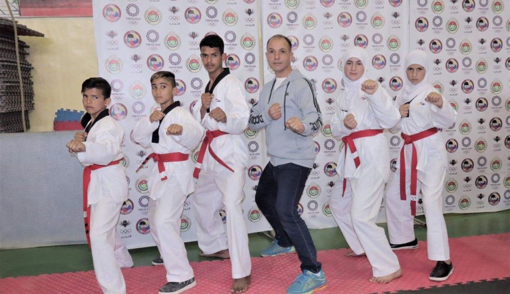 THF continues to deliver as five refugees pass black belt test at Azraq Taekwondo Academy