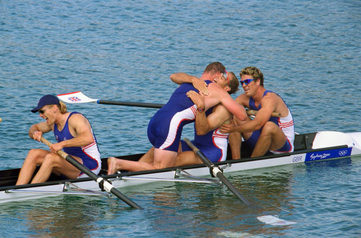 James Cracknell, right, in the aftermath of Britain's victory in the coxless fours at the 2000 Sydney Olympics, as Matt Pinsent clambers back to embrace Steve Redgrave, and Tim Foster leans on his oar ©Getty Images