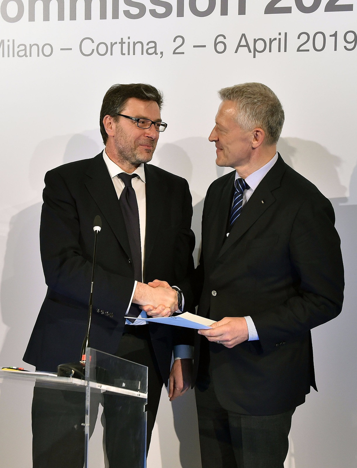 Italy's Sports Secretary Giancarlo Giorgetti delivered a letter from the country's Prime Minister to IOC Evaluation Commission Octavian Morariu confirming they will meet the financial guarantees for Milan Cortina 2026 ©Milan Cortina 2026