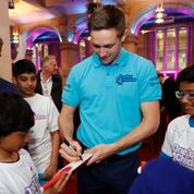 England all-rounder Chris Woakes signs autographs at the launch of a ICC funding initiative in partnership with UNICEF during this year's ICC Men's World Cup ©ICC