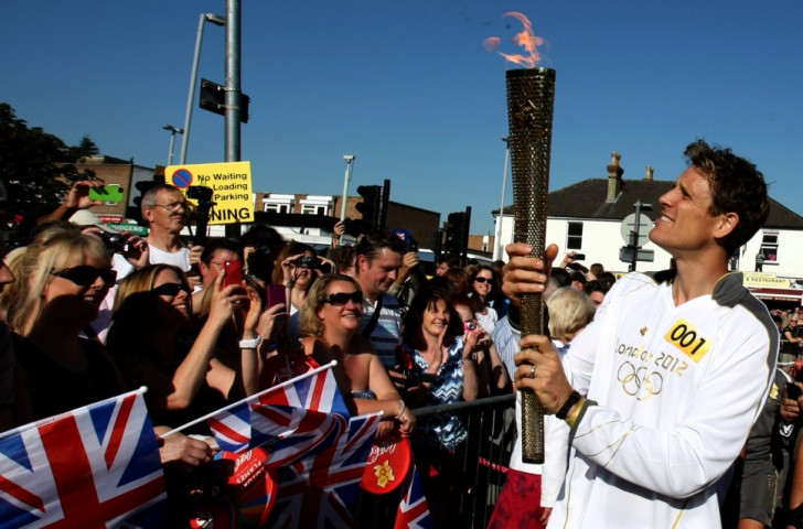 Double Olympic rowing champion James Cracknell, pictured with the Olympic torch in Kingston-upon-Thames before the London 2012 Games, has fully demonstrated that he is a competitor's competitor - but he just can't stop ©Getty Images