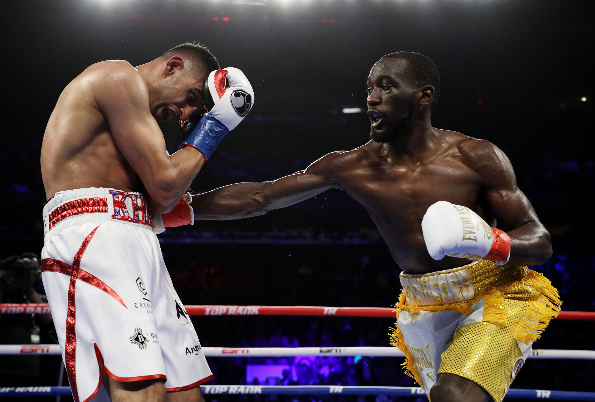 Amir Khan takes a right from Terence Crawford ©Getty Images